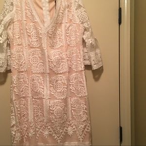 Below knee Lacey White dress . NEVER WORN